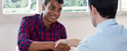 Handshake of african american male apprentice after job interview at office of company